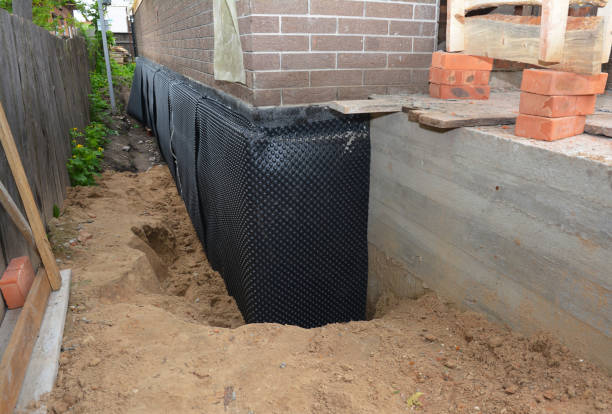 SJ Waterproofing Pros technician performing targeted Interior Drainage System assessment in Bristol, WI
